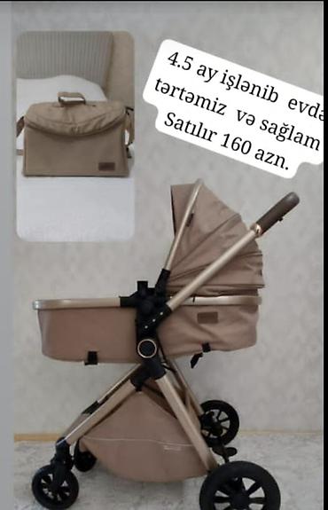 Araba-beşiklər: Uşaq arabası – bej rəngdə, yüngül alüminium gövdə və böyük təkərlər. - — 1