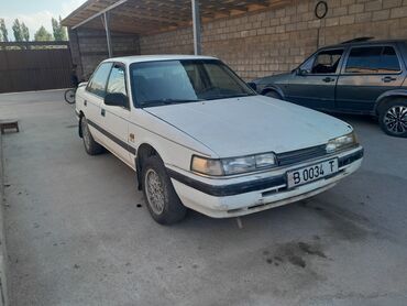 гибридный автомобиль: Mazda 626: 1991 г., 2 л, Механика, Бензин, Седан