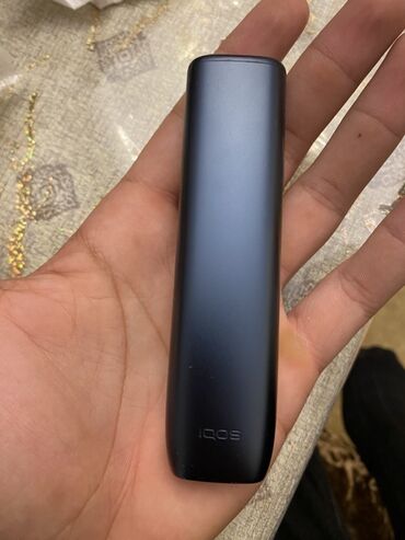 tek qaş: Məhsul: IQOS cihazı (tütün qızdırma sistemi) Xüsusiyyətlər: - Korpus