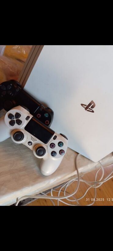 Nintendo Switch: Məhsul: Sony PlayStation 4 (PS4) – ağ rəngdə konsol + 2 ədəd DualShock