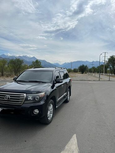 крузак 200 цена: Черный внедорожник Toyota Land Cruiser 200 с рейлингами на крыше и