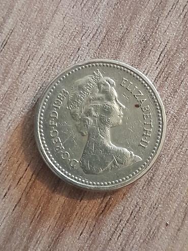 qedim pullar: Məhsul: Böyük Britaniya 1 funt sikkəsi – 1983 Təsvir: - Nominal: One — 1
