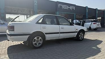автомобильное зу: Mazda 626: 1990 г., 2 л, Механика, Бензин, Седан — 2