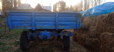 Тракторы МТЗ (Беларус): Красный трактор МТЗ, оснащенный кабиной для оператора, предназначен — 11