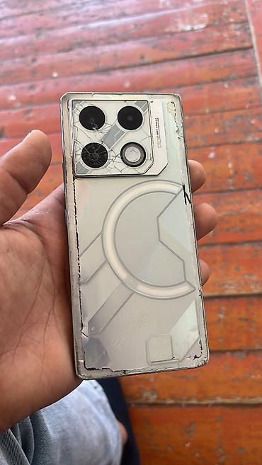 с 22 ультра: Infinix GT 20 Pro, 256 ГБ, цвет - Серебристый — 1