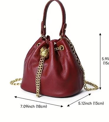 sinsey torbe: Kožna torba-buket (bucket bag) u boji slonovače sa zlatnim detaljima — 6