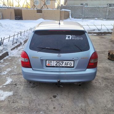 победа машина: Mazda 323 F (универсал), голубой металлик. Основные характеристики и