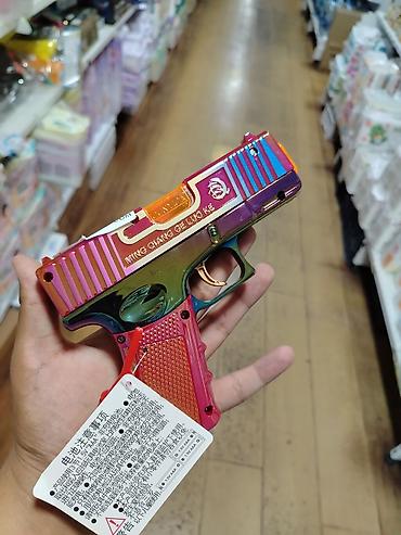 Игрушечный пистолет со световыми и звуковыми эффектами - Яркий