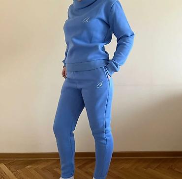 Gornji i donji deo: Ženski komplet trenerke – duks i donji deo - Model: duks sa visokim — 1