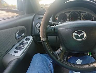 mers e210: Mazda 323: 2002 г., Механика, Хэтчбэк — 1