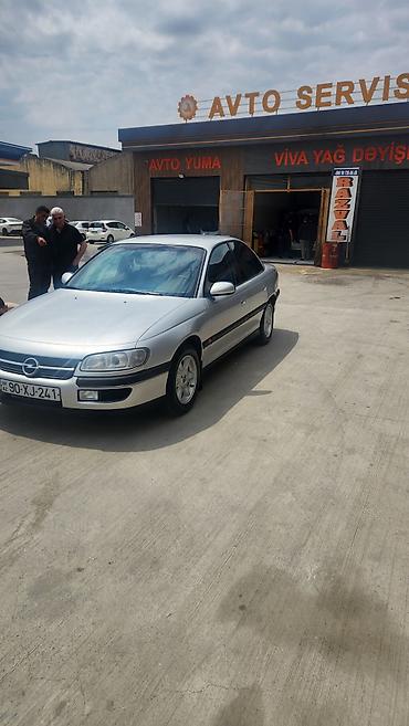 Opel: Opel Omega B sedan - Kuzov: 4 qapılı sedan, gümüş rəng - Mühərrik — 4