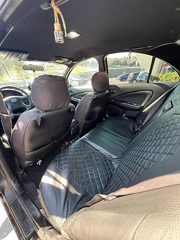 mini canta: Nissan Sunny: 1.6 l | 2006 il Sedan — 3