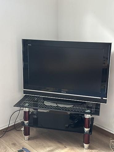 ТВ и видео: Телевизор Sony Bravia с плоским экраном на стеклянной тумбе. Основные — 2