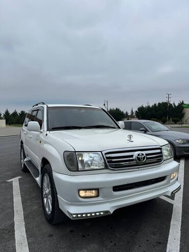 Toyota: Toyota Land Cruiser 2002 – baxımlı, əziyyət görməyib. Ağ rəngdədir — 2
