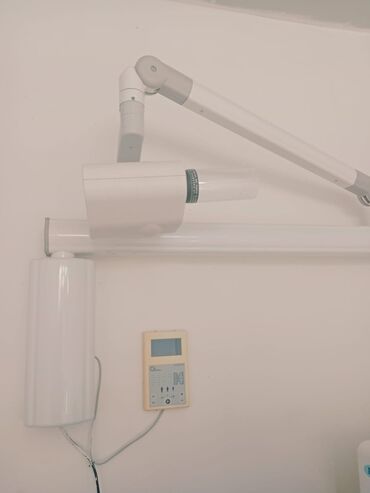 Qamət korrektorları: Divara quraşdırılmış bu stomatoloji rentgen aparatı çənə və dişlərin