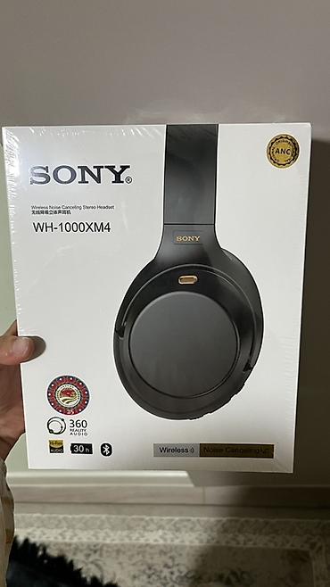 Аксессуары для консолей: Беспроводные наушники Sony WH‑1000XM4 (черные) - Активное — 2