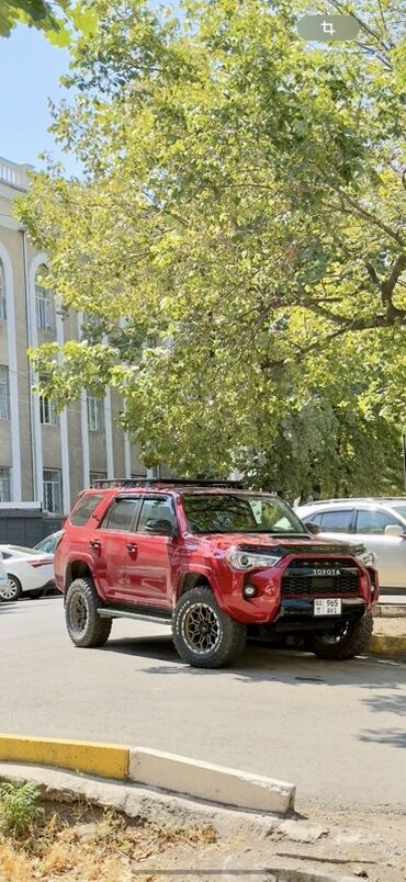 фары на нексии: Красный внедорожник Toyota 4Runner с внедорожными шинами и багажником