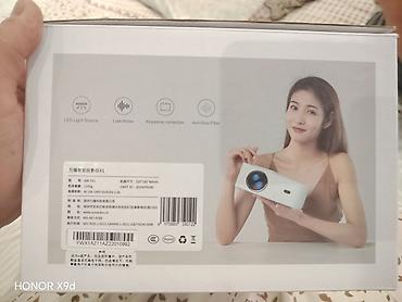 держатель наушников: Проектор Wanbo Projector (модель WB-TXL) - Компактный проектор с — 3