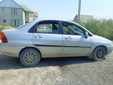 фара на дайво нубира: Suzuki Liana, седан, серебристый цвет. Основные характеристики: -