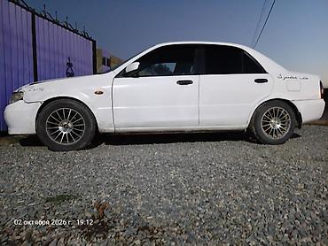 митсубиси цена: Mazda Familia: 2001 г., 1.3 л, Автомат, Бензин, Седан — 2