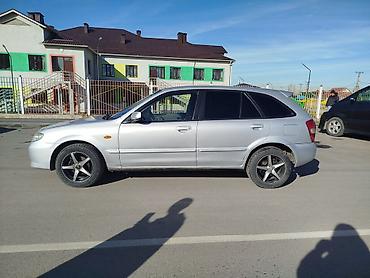 слиндир: Mazda Familia: 2002 г., Механика, Бензин, Хэтчбэк — 8