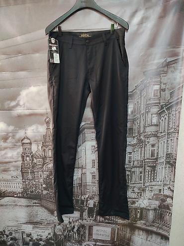 ženske kape: Zenske kozne pantalone – klasičan kroj - Boja: crna - Model: ravne — 1