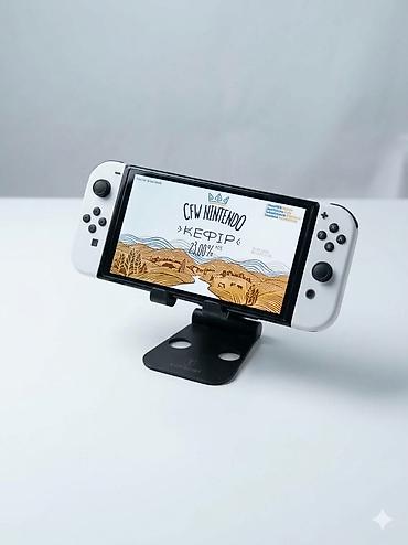 Nintendo Switch OLED: Nintendo Switch oled чипованная (прошитая) встроенная память 32гб+64гб — 1
