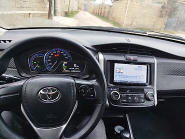 fielder: Toyota Corolla Fielder Hybrid – universal kuzovlu, ağ rəng. - Hibrid — 4
