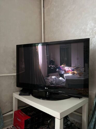 умные часы с сим картой: Телевизор LG черного цвета с плоским экраном, подходящий для домашнего