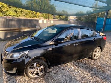 генератор на киа рио: Черный седан Kia Rio с тонированными задними стеклами и литыми