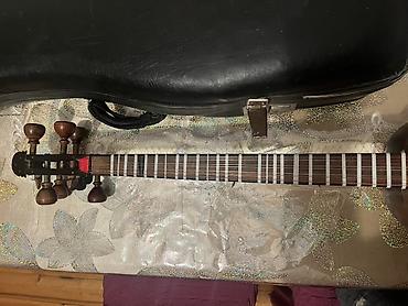 gitara satilir: Tar – milli simli musiqi aləti, sərt futlyarla Xüsusiyyətlər: - — 8