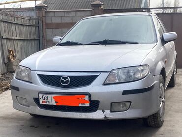 Mazda: Mazda 323: 2002 г., 1.6 л, Механика, Бензин, Седан