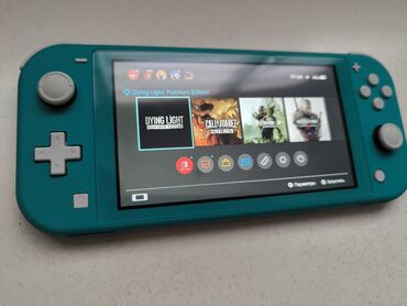 сколько стоит nintendo switch lite: Портативная игровая консоль Nintendo Switch Lite в бирюзовом цвете. В