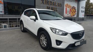 Mazda: Mazda CX-5, ağ rəngli kompakt krossover. Əsas xüsusiyyətlər: - Geniş — 4