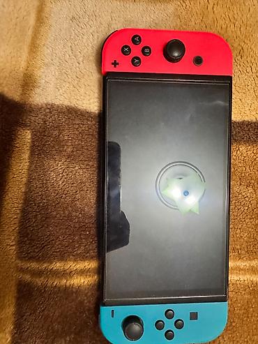 nintendo da: Nintendo Switch (OLED model) oyun konsolu – neon qırmızı və neon mavi — 1