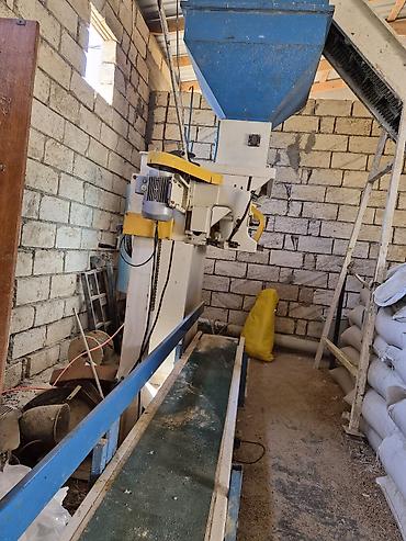 Paketləmə aparatları: Sənaye tipli kisə doldurma və tikiş xətti - Avtomatik dozajlama — 2