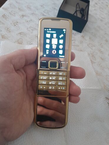 Digər mobil telefonlar: Qızılı korpuslu sürüşdürmə mexanizmalı düyməli mobil telefon — 8