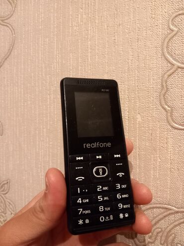 islenmis telfon: Realfone R2180 Problemsiz Telefondur Pil Saligi Yaxsı Vəziyəttədir