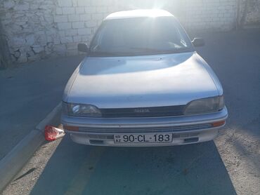 Toyota Corolla: 1.3 л | 1990 г. Седан