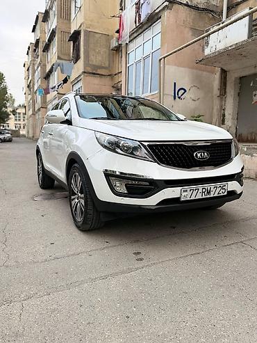 su radiatoru: Kia Sportage, ağ rəng, kompakt krossover. Güclü və qənaətcil — 3