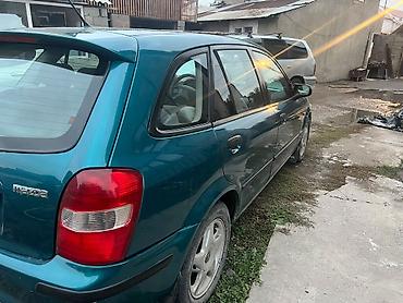 бампер виндом: Mazda Familia: 1999 г., 1.5 л, Автомат, Бензин, Седан — 7