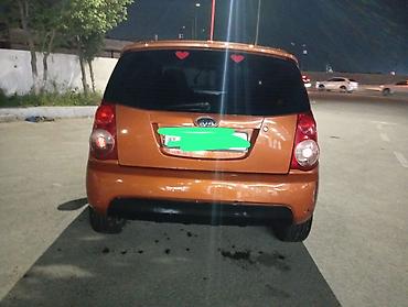 latun satisi: Kia Picanto, narıncı rəng, 5 qapılı hetçbek. Xüsusiyyətlər: - Kompakt — 1