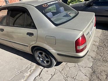 мотор нексия 1: Mazda 323: 1999 г., Седан — 4