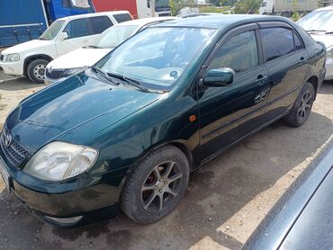 машина на свадьбу: Седан Toyota Corolla темно-зеленого цвета, оснащенный литыми дисками