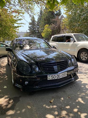 mercedes sekilleri: Mercedes-Benz E‑Class (W211) sedan – qara rəng, AMG üslublu eksteryer — 3