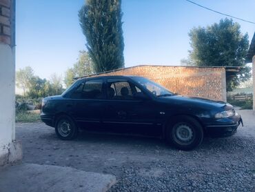 выпрямитель авто: Автомобиль Daewoo Espero, седан черного цвета. Подходит для ежедневных