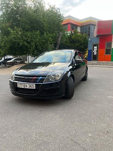 mini cooper 2009: Marka/model: Opel Astra H (hatchback, 5 qapı) Rəng: qara (parlaq) — 2