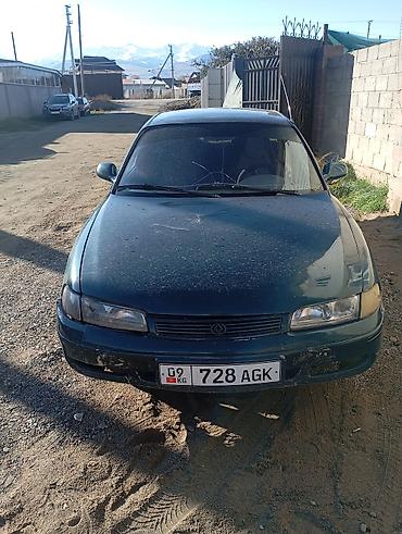 kia spektra: Mazda 323: 1993 г., Седан — 1