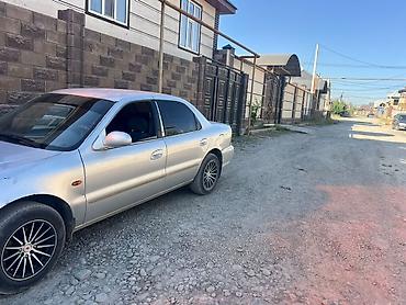 sprinter 4 4: Kia Clarus: 1999 г., Седан — 2