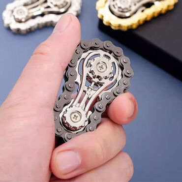 Игрушки: Небольшой спиннер из металла, выполненный в виде велосипедной цепи — 5